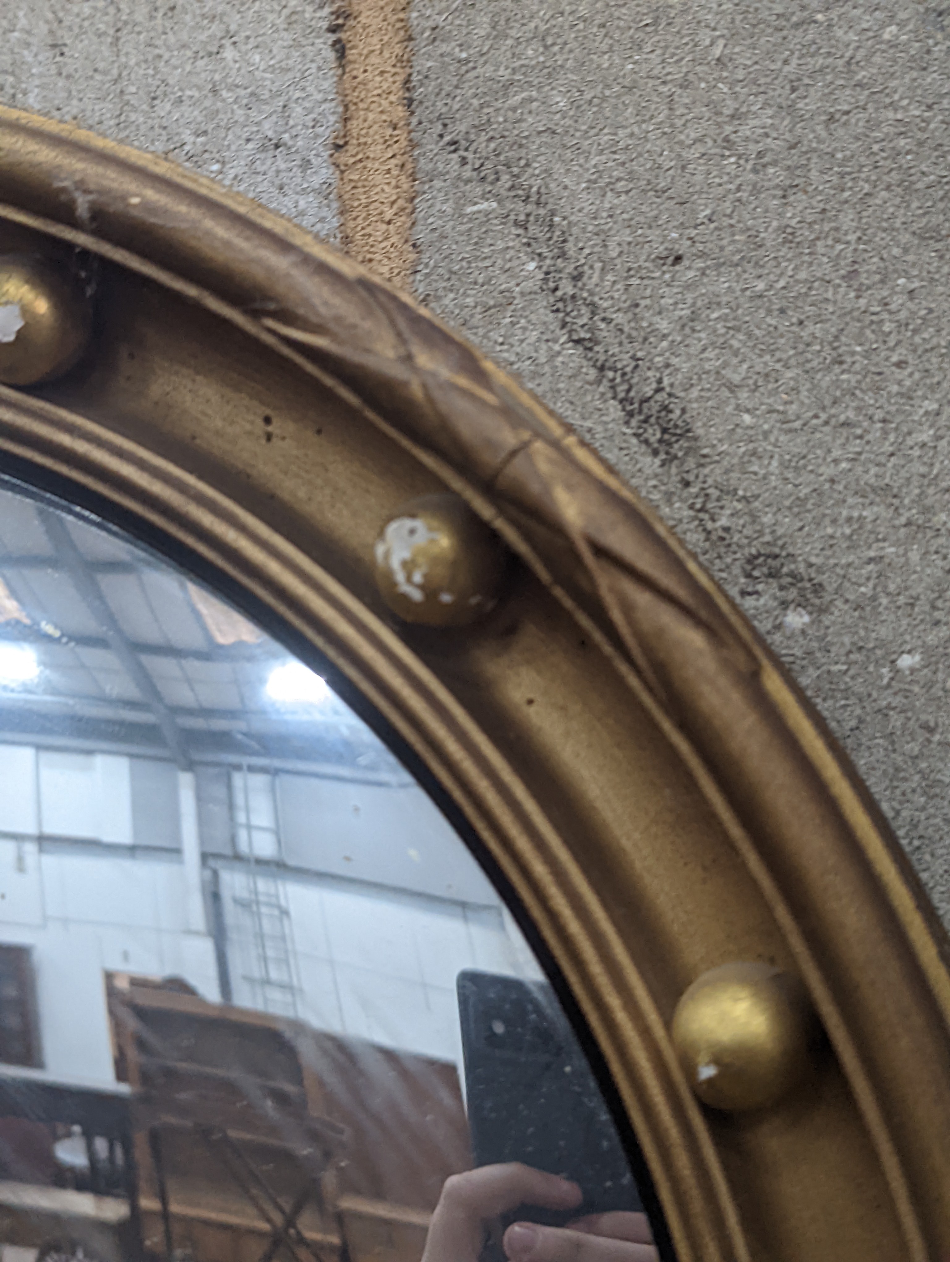 A Regency style circular gilt framed convex wall mirror, diameter 45cm